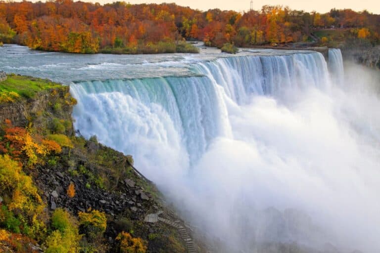 Niagara Falls Tours From Toronto: View of the falls surrounded by orange and red fall foliage