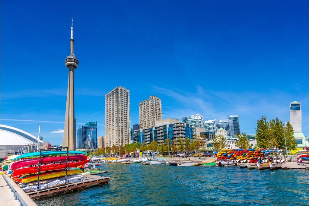 Why visit Toronto? A view of the CN Tower and City Skyline from a canoe dock at the Toronto waterfront.