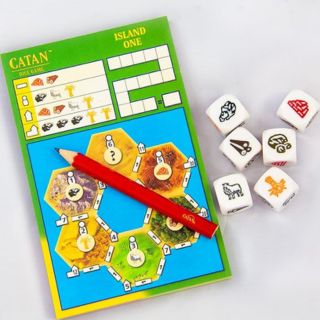 The Catan Dice Game, which is a compact board game that makes one of the best gifts for backpackers under $25.