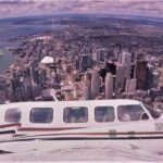 The small plane flying over Toronto on the Exhilarating 120km Aerial Tour of Toronto with iflyTOTO.