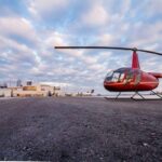 View of a parked red helicopter, from the 14-minute helicopter tour in Toronto.