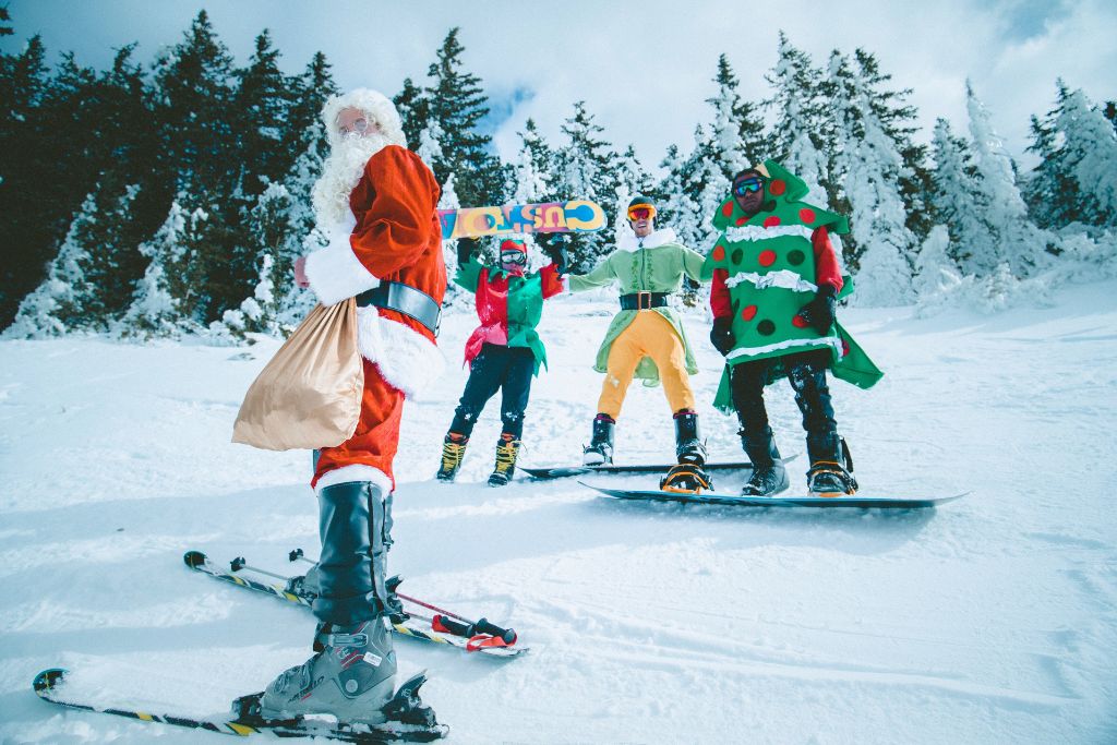 Fun facts about Canada: Santa Clause and three of his elves skiing.