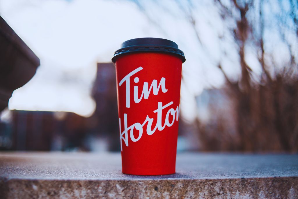 A red coffee cup from Tim Hortons, Canada's most famous coffee chain. 