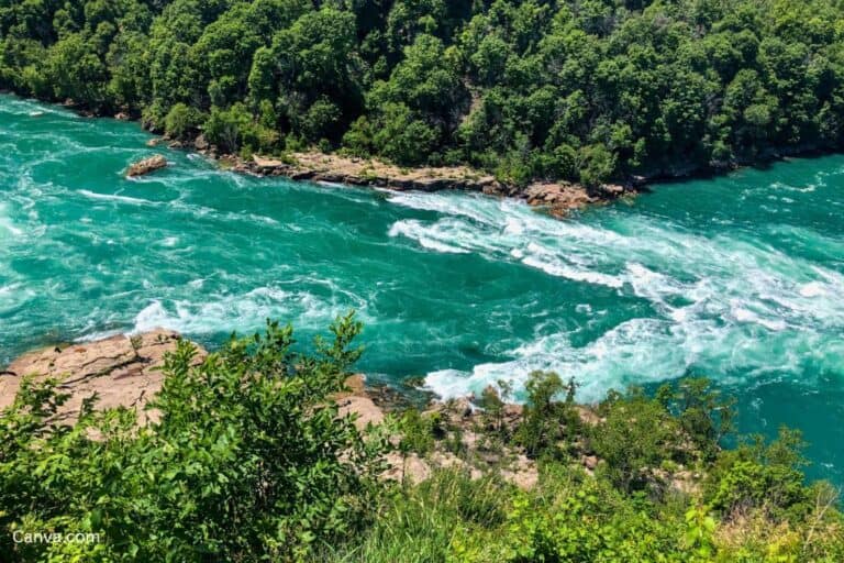 A view from above of the Whirlpool and beautiful white foamy rapids downstream from Niagara Falls. Photo by Sandra Lund via Canva.com.