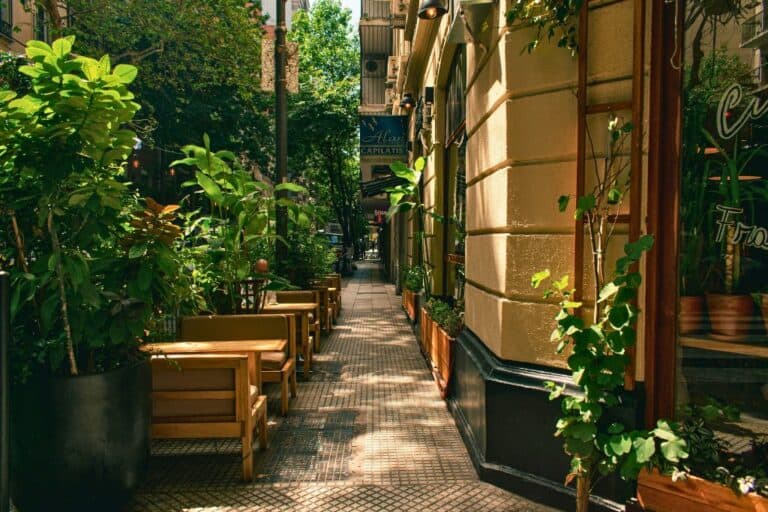 Where to stay in Buenos Aires: A charming outdoor cafe surrounded by greenery in Buenos Aires.